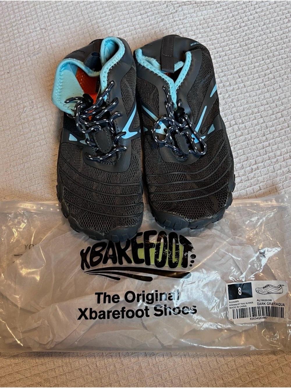 XBAREFOOT Men’s Black Athletic Minimalist Shoes with Light Blue Trim